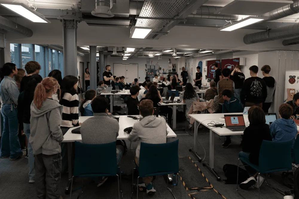 A large group of teenagers stood in front of the Raspberry Pi Foundation office