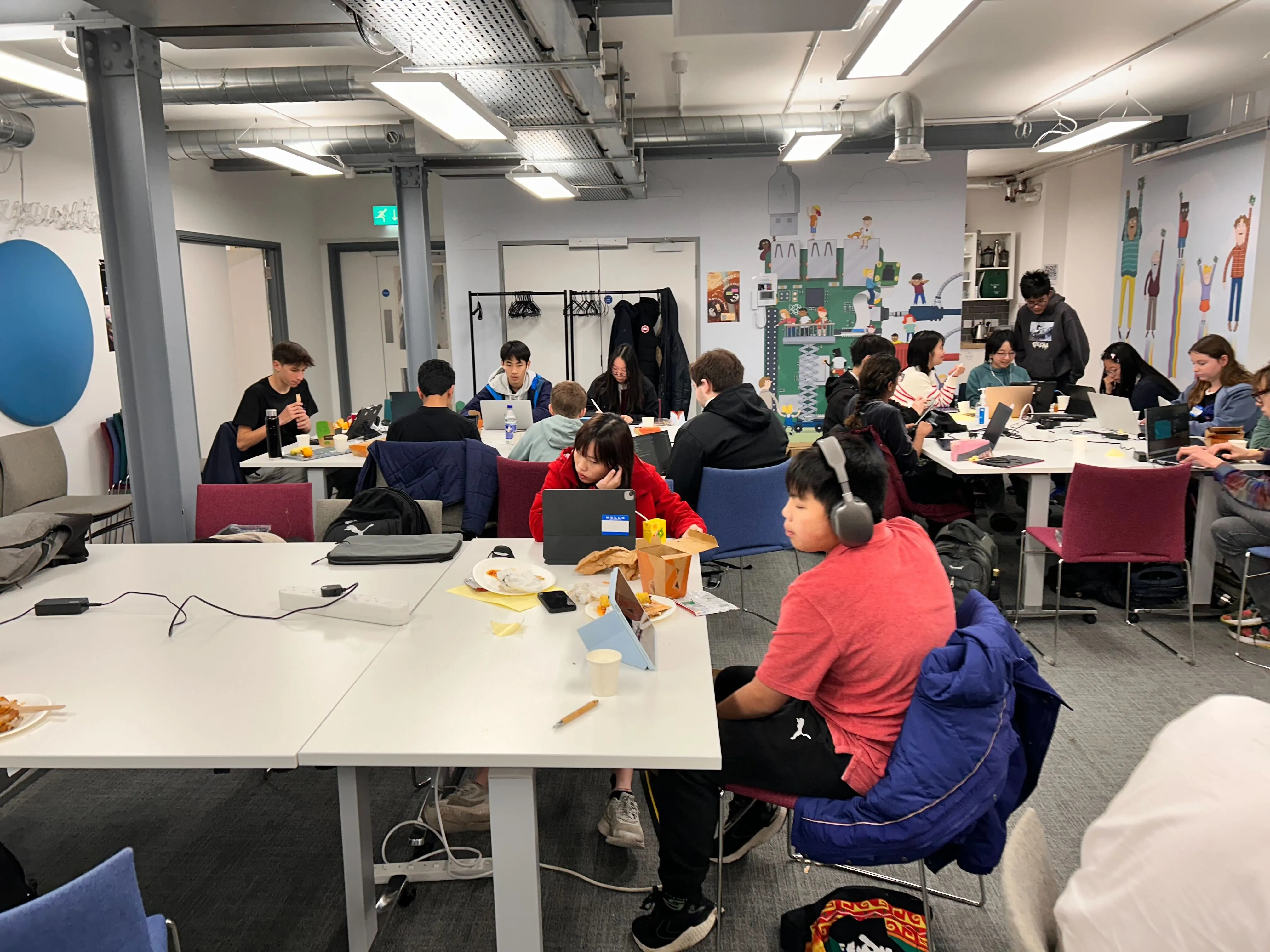 A large group of teenagers stood in front of the Raspberry Pi Foundation office